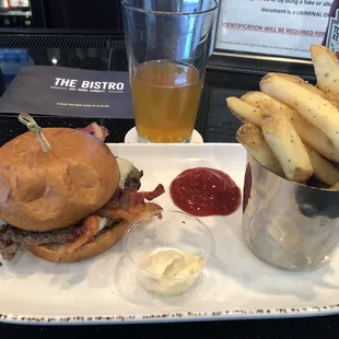 a burger and fries with ketchup