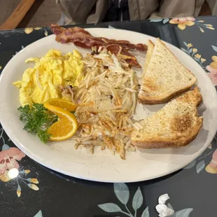 Scrambled eggs with bacon and home fries