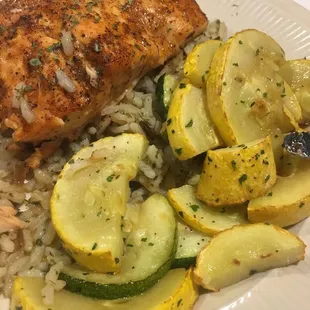 a plate of fish and vegetables
