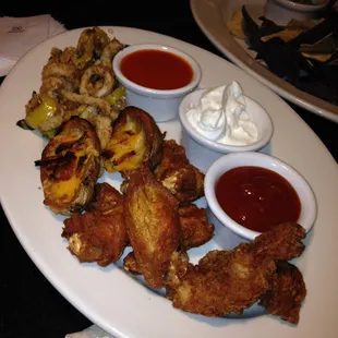 Sample platter: 2 potato skins, 6 wings, 2 chicken strips, 1-2 order calamari for only $8 happy hour