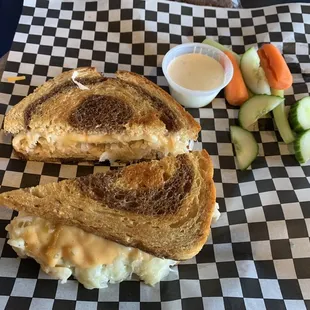 Great price for a Turkey Reuben sandwich with sauerkraut, cheese, and thousand island dressing on rye bread with side of fresh veggies $9.95