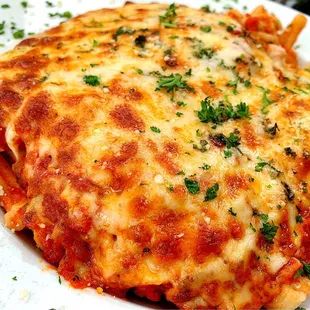 a plate of lasagna on a table