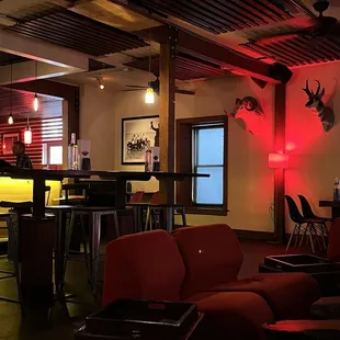 a bar with red lighting