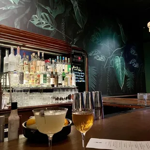 two glasses of wine on the bar