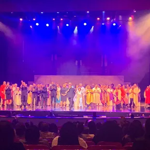 The cast and choir directors provide an encore singing performance at the end of the musical