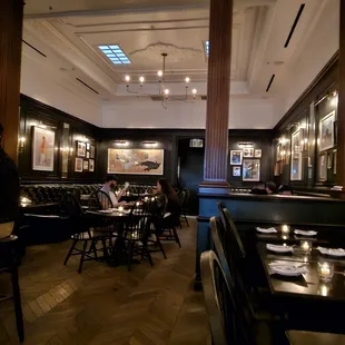 a man sitting at a table in a restaurant