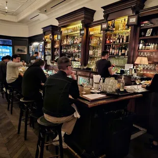 people sitting at a bar