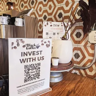 a coffee maker and a qr code