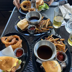 Sharezies of steak dip and fish sandwiches.