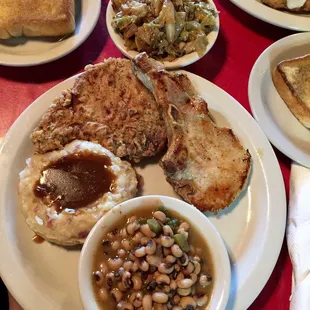 Fried Porkchop was way better than the grilled, mashed Potatoes, fried cabbage &amp; of course, black eyed peas.. get this!!