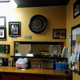 LOVE the wall hanging behind the counter: "Be nice or leave."