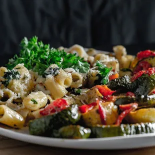 a plate of pasta and vegetables