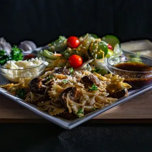 a plate of pasta and vegetables