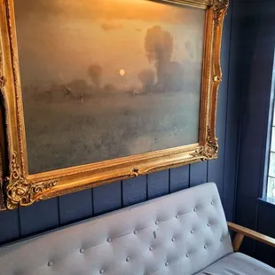 a painting hanging on the wall
