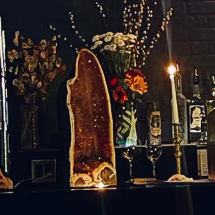 a glass of wine and a candle