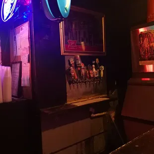 a bar with neon signs