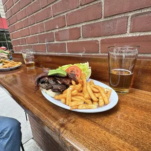 Black Sheep Burger  with nice season fries  and a local ALE beer  w the coworker :)  cheers