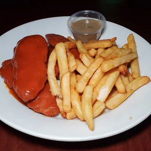 a plate of french fries and ketchup