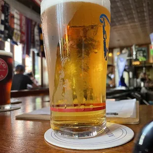 a pint of beer on a table