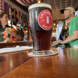 a pint of beer on the bar