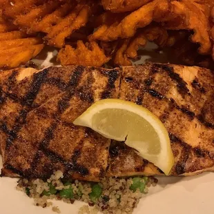 a plate of fish and sweet potato fries