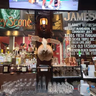 a bar with a large screen tv
