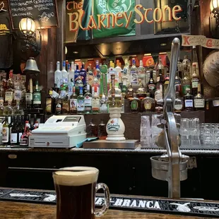 a glass of beer on the bar