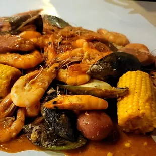  plate of seafood and corn