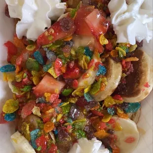 12 ct pancakes w/ strawberries, bananas, fruity pebbles, whipped cream, caramel, and original syrup