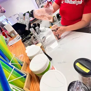 a woman making a smoothie