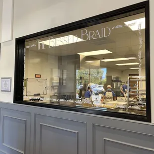 a view of a bakery through a window