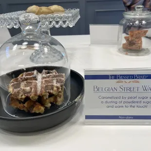 a bowl of bread and a glass dome