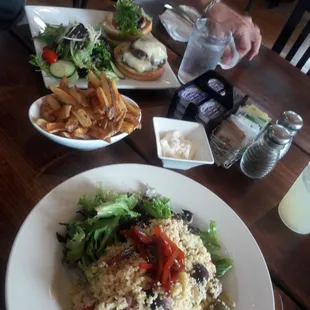 Cheeseburger, fries with garlic aioli, cous cous salad.