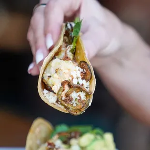 Cilantro-Lime Grilled Shrimp Tacos - avocado corn relish, chipotle aioli, crispy jalapeño, bacon crumble, queso fresco