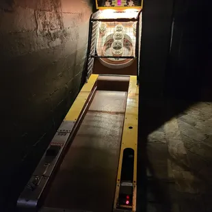 a pinball machine in a dark room