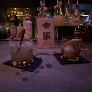 Whiskey sour and Butler's Old Fashioned