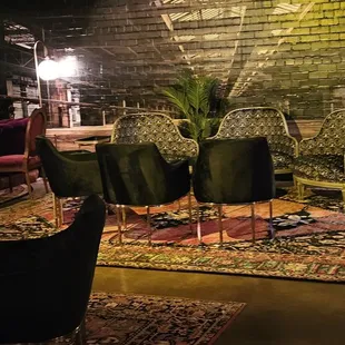 a living room with a brick wall