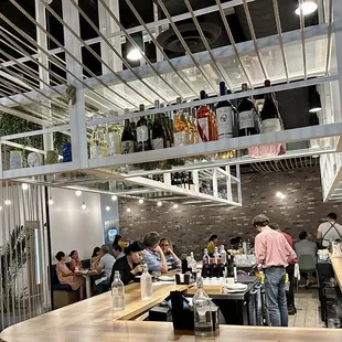 people sitting at tables in a restaurant