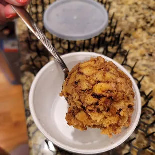 This is $7.00 togo bread pudding. It&apos;s balanced on a tablespoon and it&apos;s about 1/3 cup.