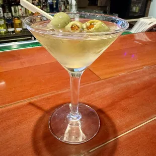 a martini with olives in it