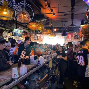a crowd of people at a bar