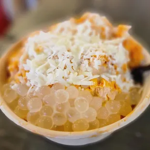 a bowl of food with a spoon in it