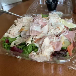 a salad in a plastic container