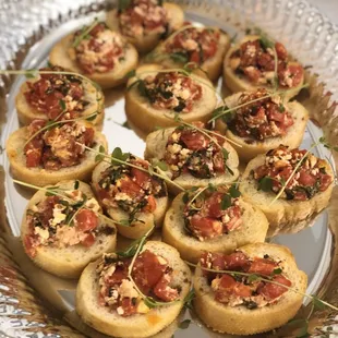 Bruschetta on Crostini topped with pea shoots