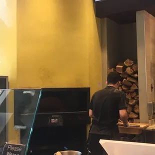 The oven uses propane gas and not real wood logs