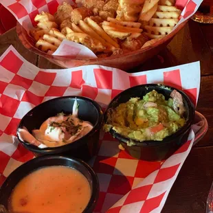 Dips- guacamole, garlic aioli (to die for!) and vegan queso with waffles fries and tots
