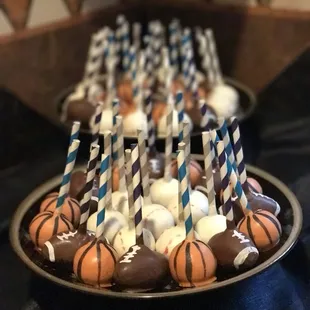 Basketball and baseball and football cake pops