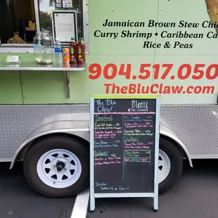 a sign outside of a food truck