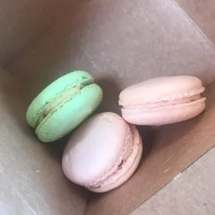 three macarons in a box