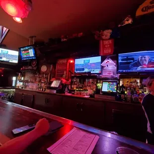 a woman sitting at a bar